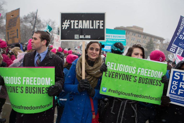 Demonstrators gather outside the U.S. Supreme Court on March 25 to hear oral arguments for the Sebelius v. Hobby Lobby case. (Graeme Jennings/Examiner)