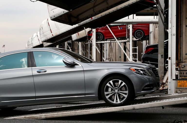 In this March 27, 2014 photo, a Mercedes-Benz sedan rolls onto a car-carrier at the company's Vehicle Processing Center in Baltimore. The Commerce Department issues its April report on wholesale stockpiles on Tuesday, June 10, 2014. (AP Photo/Patrick Semansky)