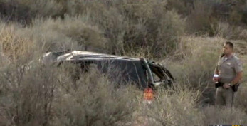 This video frame provided by KABC TV Los Angeles shows a California Highway Patrol officer during an investigation of a crash of an SUV in Action, Calif. on Sunday, March 24, 2013. A 9-year-old girl crawled out of the mangled SUV, climbed out of a canyon and walked about a mile in the middle of the night to find help after surviving the highway crash that killed her father in Southern California, authorities said. (AP Photo/KABC TV)