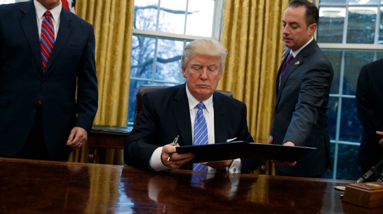 President Trump signed an executive order Tuesday directing executive departments and agencies to expedite reviews and approvals of proposals to build new manufacturing facilities in order to spark more investment in American manufacturing. (AP Photo/Evan Vucci)