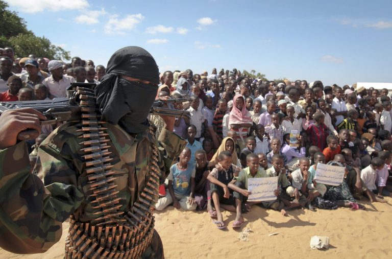 An armed member of the militant group al Shabaab attends a rally on the outskirts of Mogadishu, Somalia. (AP Image)