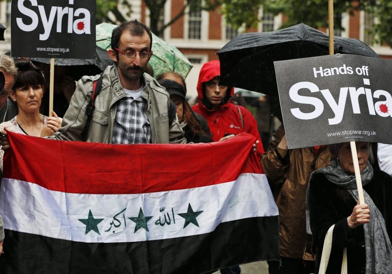 Protesters demonstrate against western intervention in Syria, outside the US embassy in central London, Saturday, June 15, 2013.(AP Photo/Lefteris Pitarakis)