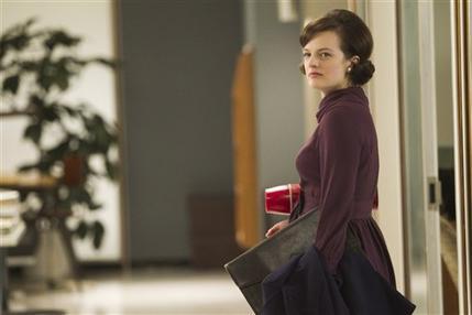 In this publicity photo released by AMC, Elisabeth Moss as Peggy Olson is shown in Episode 11, Season 5, of 