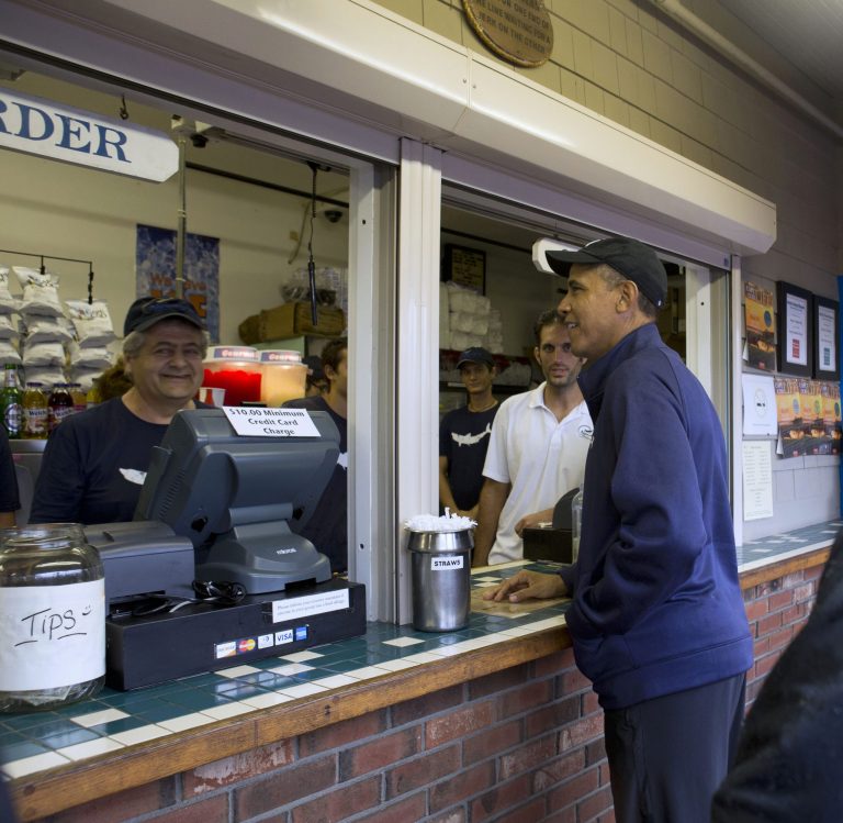 President Barack Obama orders lunch at Nancy's restaurant in Oak Bluffs, Mass., on the island of Martha's Vineyard, Tuesday, Aug. 13. The President and first lady are on vacation on the island. (AP/Jacquelyn Martin)