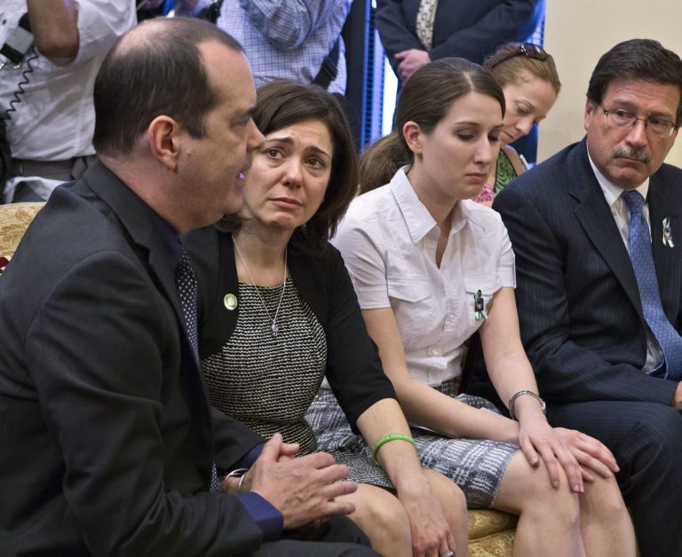 Families of victims of the Sandy Hook Elementary School shooting in Newtown, Conn., meet with Sen. Joe Manchin, D-W.Va., after he announced a bipartisan deal on expanding background checks to more gun buyers, on Capitol Hill in Washington, Wednesday, April 10, 2013. From left are David and Francine Wheeler, who lost their 6-year-old son Ben in the shooting, Katy Sherlach and her father Bill Sherlach, whose wife Mary Sherlach was killed. (AP Photo/J. Scott Applewhite)