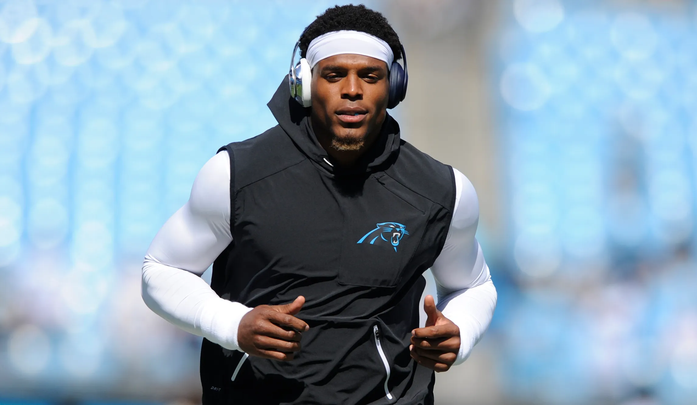 Quarterback Cam Newton is vaccinated against COVID-19 and wants to play football again