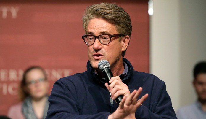 "They're going to die, and then you're going to be left holding the bill," Joe Scarborough said of Baby Boomers and Gen Xers. (AP Photo/Steven Senne)