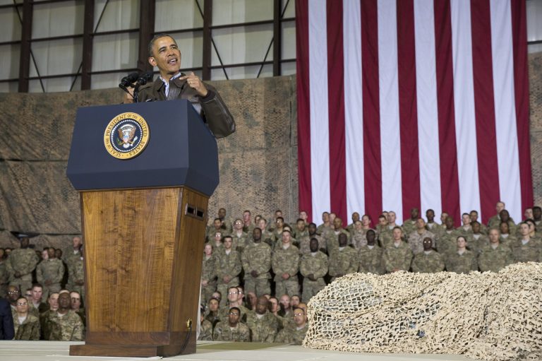 FILE - This May 25, 2014 file photo shows President Barack Obama speaking during a troop rally after arriving at Bagram Air Field for an unannounced visit, north of Kabul, Afghanistan. Senior U.S. administration officials say President Barack Obama will seek to keep 9,800 U.S. troops in Afghanistan after the war formally ends later this year. Nearly all of those forces are to be out by the end of 2016, as Obama finishes his second term. (AP Photo/ Evan Vucci, File)