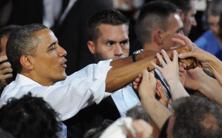 President Barack Obama greets the crowd after a campaign stop at the historic Fire Station No.1, in downtown Roanoke, Virginia, Friday, July 13, 2012. Obama traveled to southwest Virginia to discuss choice in this election between two fundamentally different visions on how to grow the economy, create middle-class jobs and pay down the debt. (AP Photo/Don Petersen)