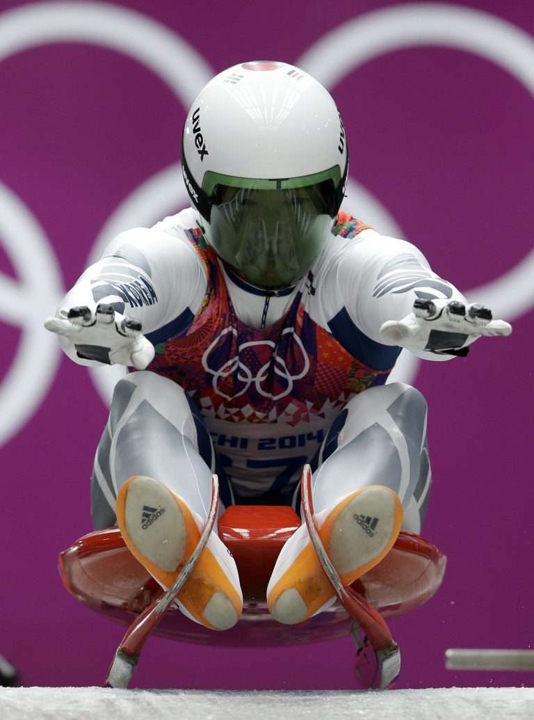 Kim Donghyeon of South Korea starts his second run during the men's singles luge competition at the 2014 Winter Olympics, Saturday, Feb. 8, 2014, in Krasnaya Polyana, Russia. (AP Photo/Natacha Pisarenko)