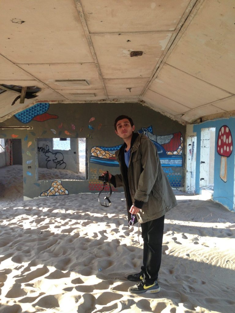 This undated photo of Argentinian artist Adrian Villar Rojas at Adapted Aquatics, Fort Tilden, NY, is provided by the Museum of Modern Art, MoMA PS1, in New York,  Friday, June 27, 2014. New York's Rockaway peninsula is the site of an arts festival featuring singer-songwriter Patti Smith and other artists. The free Rockaway! festival, conceived by Smith and Rockaway resident Klaus Biesenbach, director of MoMA PS1, celebrates the reopening of Fort Tilden, a former U.S. Army installation that's part of Gateway National Recreation Area. It opens Sunday June 28, 2014 and runs through Sept. 1, 2014. (AP Photo/Museum of Modern Art)