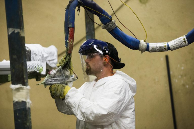 In this Aug. 7, 2014 photo, a worker assembles construction supplies at Northeast Building Products in Philadelphia. The Institute for Supply Management, a trade group of purchasing managers, issues its index of manufacturing activity for August on Tuesday, Sept. 2, 2014. (AP Photo/Matt Rourke)