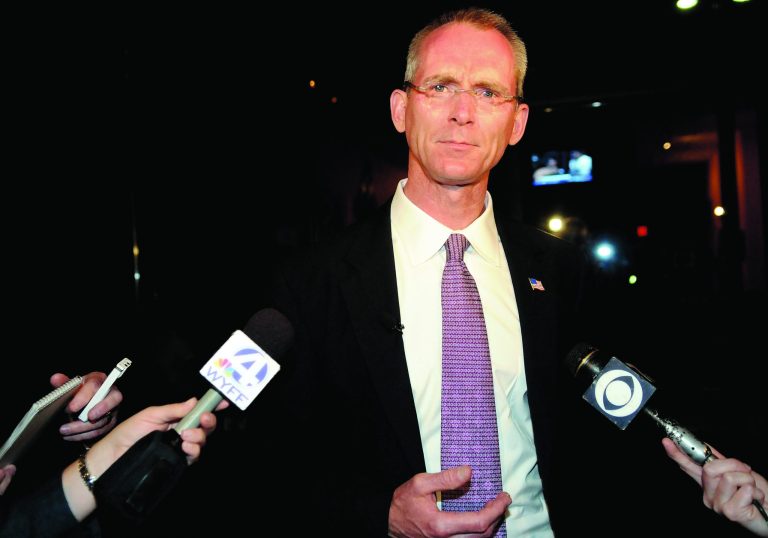 FILE - In this Tuesday June 22, 2010 file photo, South Carolina congressional candidate Bob Inglis speaks to the reporters after his loss in the runoff election to Trey Gowdy in Greenville, S.C. A carbon tax has been revived by some on both right and left spectrum of politics and is suddenly the hot topic of opinion pieces and quiet discussions. 