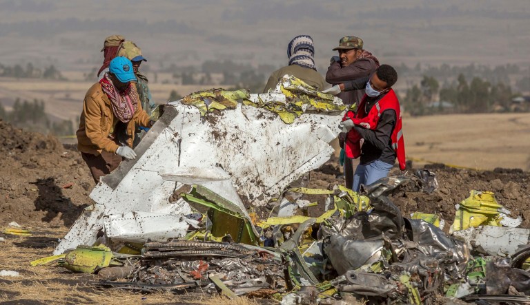 Rescuers work at the scene of an Ethiopian Airlines flight crash near Bishoftu, or Debre Zeit, south of Addis Ababa,  Ethiopia, Monday, March 11, 2019.
