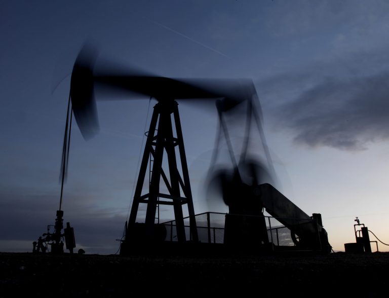 In this Tuesday, March 6, 2012, file photo taken with a long time exposure, a pumping unit sucks oil from the ground near Greensburg, Kan. (AP Photo/Charlie Riedel, File)