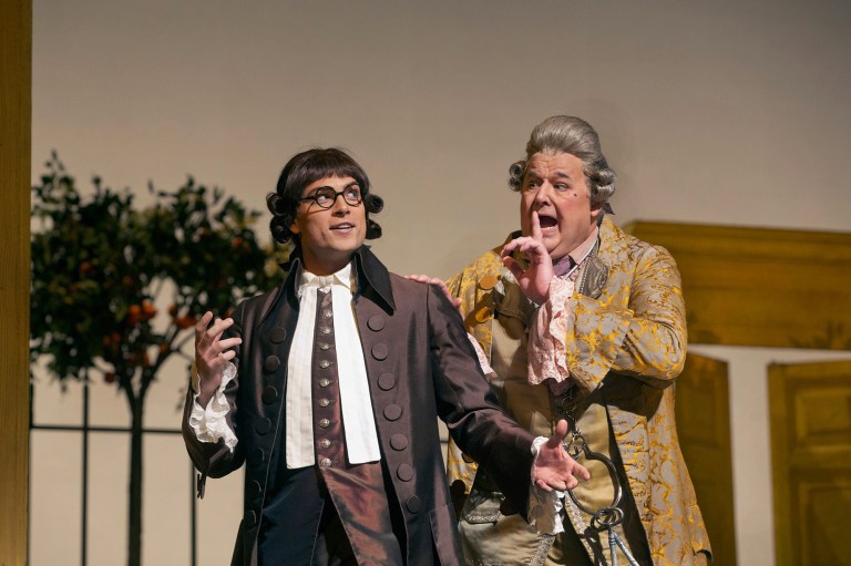   In this Dec. 14, 2012 publicity photo, Alek Shrader as Count Almaviva (in disguise as Don Alonso) and John Del Carlo as Dr. Bartolo are seen in Rossini's 