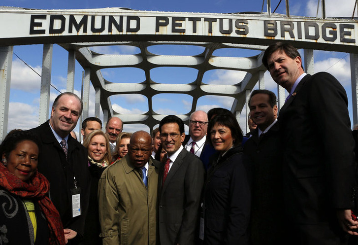 Majority Leader Eric Cantor stands alongside Rep. John Lewis on the Edmund Pettus Bridge in Selma last weekend during the commemoration of the 50th anniversary of the civil rights movement.