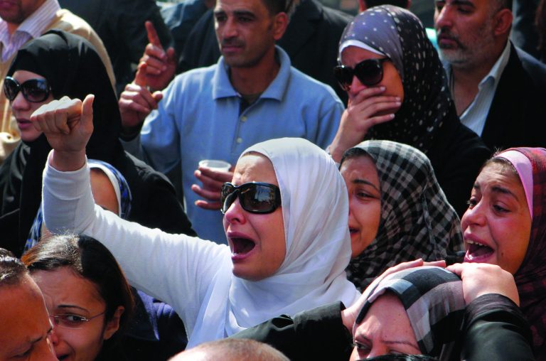 Egyptian relatives of Mohammed Saad, a 20-year-old protester, who died of wounds sustained during clashes last Friday near the presidential palace, grieve during his funeral procession in Tahrir Square, Cairo, Egypt, Monday, Feb. 4, 2013. More than 60 people have died in recent protests across Egypt that began on Thursday, Jan. 24, 2013, the eve of the second anniversary of the start of the uprising that toppled autocrat Hosni Mubarak. (AP Photo/Amr Nabil)