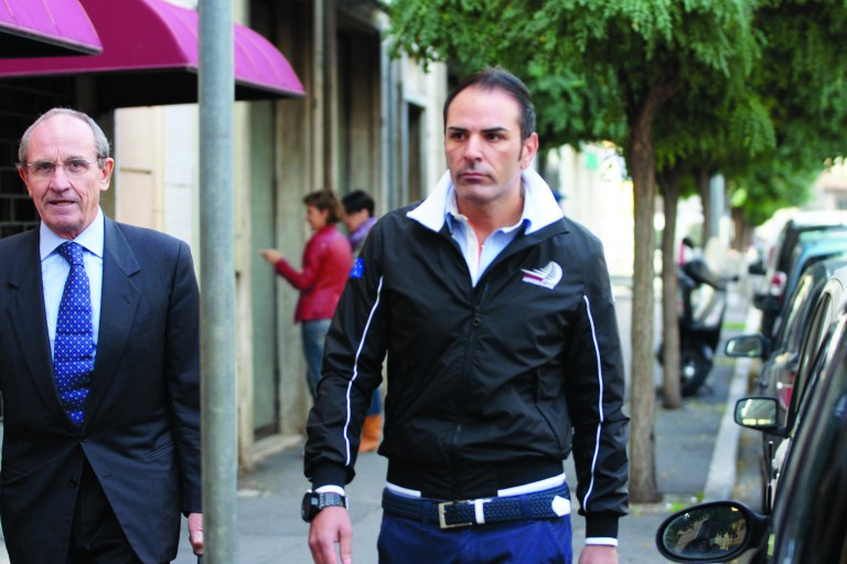 Costa Concordia first officer Ciro Ambrosio arrives at the Teatro Moderno theatre for the first hearing for the Jan. 13, 2012 tragedy, where 32 people died after the luxury cruise liner Costa Concordia was forced to evacuate some 4,200 passengers after it hit a rock while passing too close to the Giglio Island, in Grosseto, Italy, Monday Oct. 15, 2012. Hearings this week will help decide whether a judge will order the trial for former ship's captain Francesco Schettino, who is accused of manslaughter, causing the shipwreck and abandoning ship while passengers and crew were still aboard. (AP Photo/Alessandro La Rocca, Lapresse) ITALY OUT