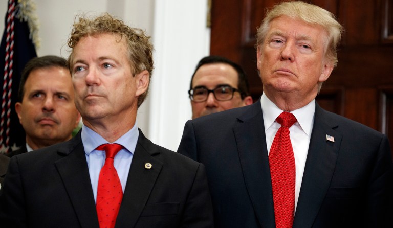 President Donald Trump stands with Sen. Rand Paul, R-Ky., during an event to sign an executive order on health care in the Roosevelt Room of the White House, Thursday, Oct. 12, 2017, in Washington.