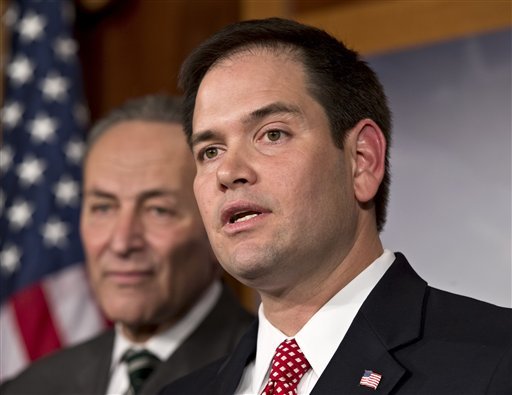 Sen. Marco Rubio, R-Fla., right, and Sen. Charles Schumer, D-N.Y., left, join a bipartisan group of leading senators to announce that they have reached agreement on the principles of sweeping legislation to rewrite the nation's immigration laws, during a news conference at the Capitol in Washington, Monday, Jan. 28, 2013. The deal covers border security, guest workers and employer verification, as well as a path to citizenship for the 11 million illegal immigrants already in this country.  (AP Photo/J. Scott Applewhite)