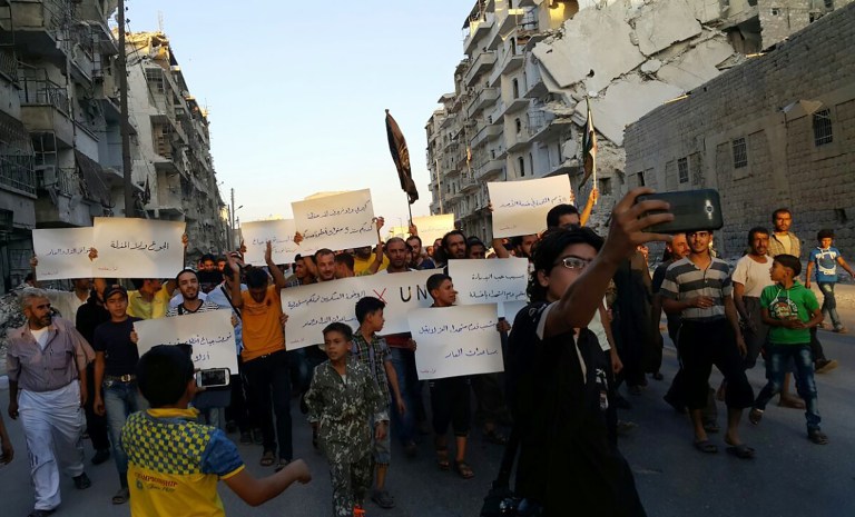 While a State Department spokesman admitted there is no boost in humanitarian aid yet, he refused to say that the deal isn't being fulfilled so far, and wouldn't say how many days so far have qualified toward the seven-day goal of peace and more aid. (Modar Shekho via AP)