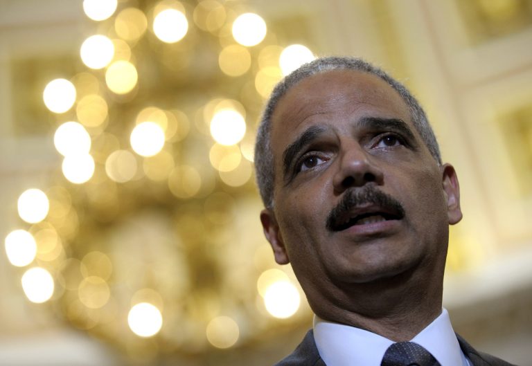 Attorney General Eric holder speaks to reporters following his meeting on Capitol Hill in Washington, Tuesday, June 19, 2012. Holder wants a House panel to drop plans to try to hold him in contempt of Congress, and the panel's chairman wants more Justice Department documents regarding Operation Fast and Furious, a flawed gun-smuggling probe in Arizona. Holder and Rep. Issa met in an effort to resolve their dispute over the investigation of Fast and Furious by the House Oversight and Government Reform Committee that Issa chairs.(AP Photo/Susan Walsh)