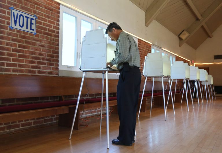 Mike Lee marks his ballot while voting in the California Primary, in Sacramento,Calif., Tuesday, June 3, 2014.  With no divisive ballot initiatives or high-profile races a low voter turnout is expected.(AP Photo/Rich Pedroncelli)