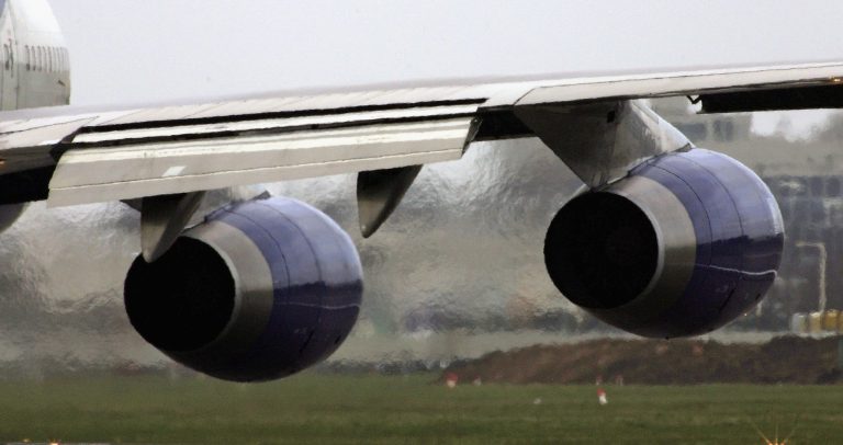 Exhaust emits from the engines of a passenger jet as it prepares for take off. Air travel is the fastest growing source of greenhouse gas emissions. (Scott Barbour/Getty Images)