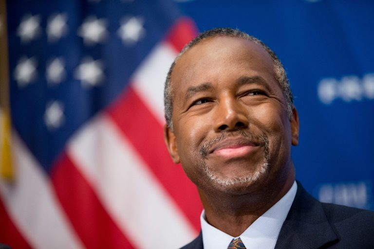 Trump barely edges out Carson 24 percent to 23 percent. (AP Photo/Andrew Harnik)