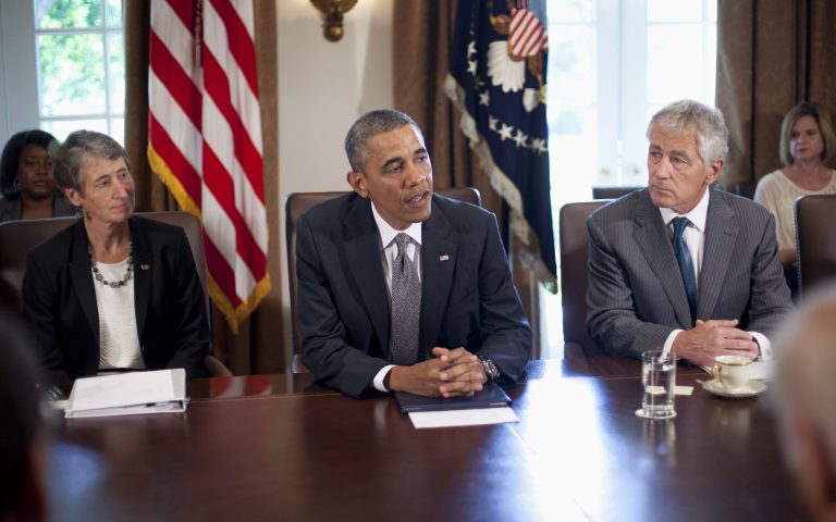 President Obama, flanked by Interior Secretary Sally Jewell and Defense Secretary Chuck Hagel, speaks to members of the media before the start of a cabinet meeting in the Cabinet Room of the White House on Thursday. (AP Photo/Pablo Martinez Monsivais)