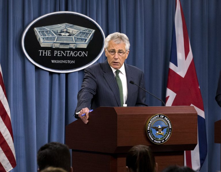 Secretary of Defense Chuck Hagel answers questions on Syria during a joint news conference with the United Kingdom's Secretary of State for Defence Phillip Hammond, at the Pentagon in Washington, Thursday, May 2, 2013.  (AP Photo/J. Scott Applewhite)