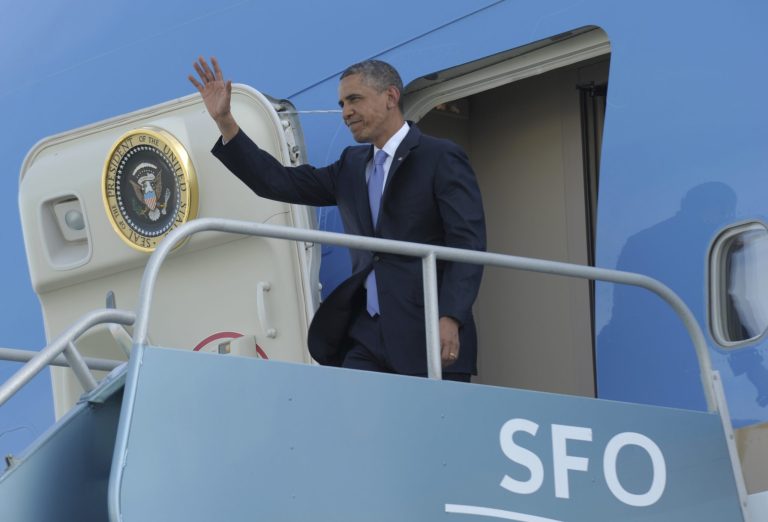President Barack Obama waves from the top of the steps of Air Force One at San Francisco International Airport in San Francisco, Wednesday, April 3, 2013. Obama will be attending Democratic fundraisers while in California. (AP Photo/Susan Walsh)