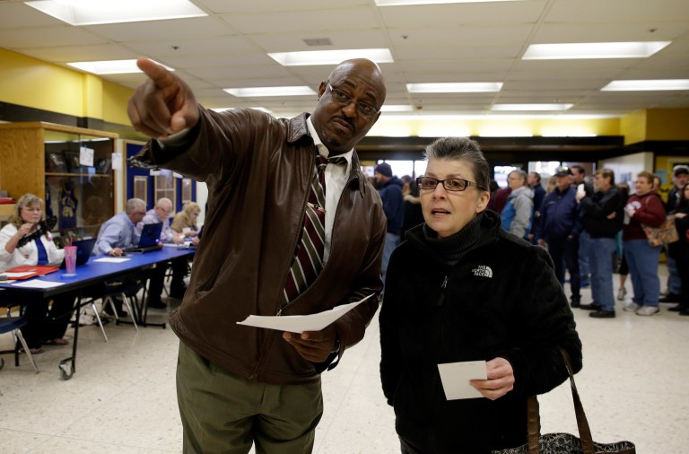 There have been reported instances of caucus volunteers being overwhelmed and failing to check identifications against voter registration lists, leaving open envelopes of completed ballots unattended and running out of ballots. (AP Photo/Marcio Jose Sanchez)