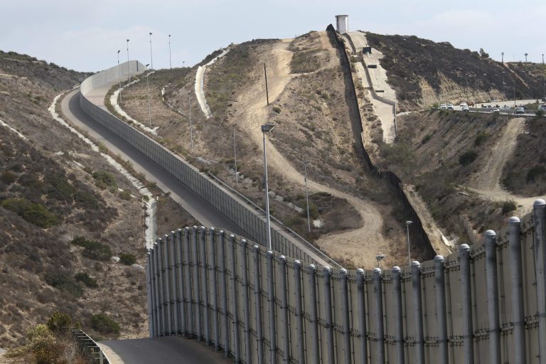 Sections of the U.S.-Mexico border fence climb a hill near San Diego, Calif. (John Moore/Getty Images)