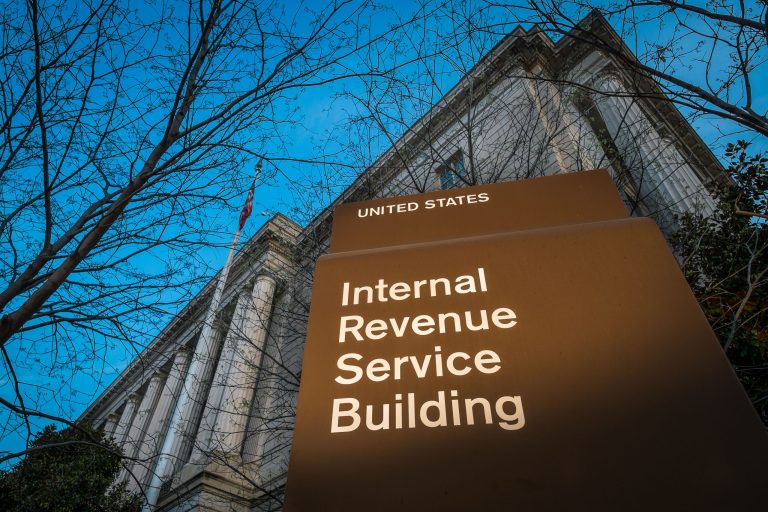 This photo taken April 13, 2014 shows the headquarters of the Internal Revenue Service (IRS) in Washington at daybreak. Tuesday, April 15, is the federal tax filing deadline for most Americans. (AP Photo/J. David Ake)