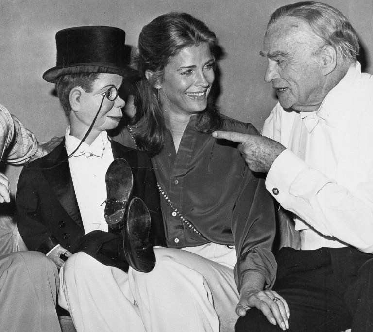 FILE - This Sept. 30, 1978 file photo shows dummy Charlie McCarthy crossing his legs on the lap of actress Candice Bergen as her father, ventriloquist Edgar Bergen, points at Caesar's Palace Hotel in Las Vegas at Edgar Bergen's farewell performance before his intended retirement. He died in his sleep later that night. A spokeswoman for Candice Bergen says the actress is developing a film about her late father. Spokeswoman Heidi Schaeffer said Tuesday, April 30, 2013, that the big-screen project will be based on Candice Bergen's 1984 memoir, 