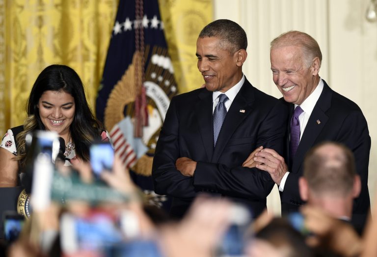 President Barack Obama, center, standing with Vice President Joe Biden, right, listens as Diana Calderon, a student who has benefited from the Deferred Action for Childhood Arrivals (DACA) program. President Trump has indicated he won't target DACA recipients. (AP Photo/Susan Walsh)