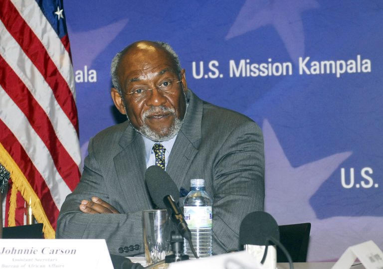   FILE - This July 27, 2010 file photo shows Johnnie Carson, the assistant secretary of state for African affairs, addressing journalists in Kampala, Uganda. Carson, the highest ranking U.S. official to visit Somalia's capital in years landed in Mogadishu on Sunday, June 10, 2012 in another sign of improving security in the Horn of Africa's most chaotic nation. (AP Photo/Stephen Wandera, file)  