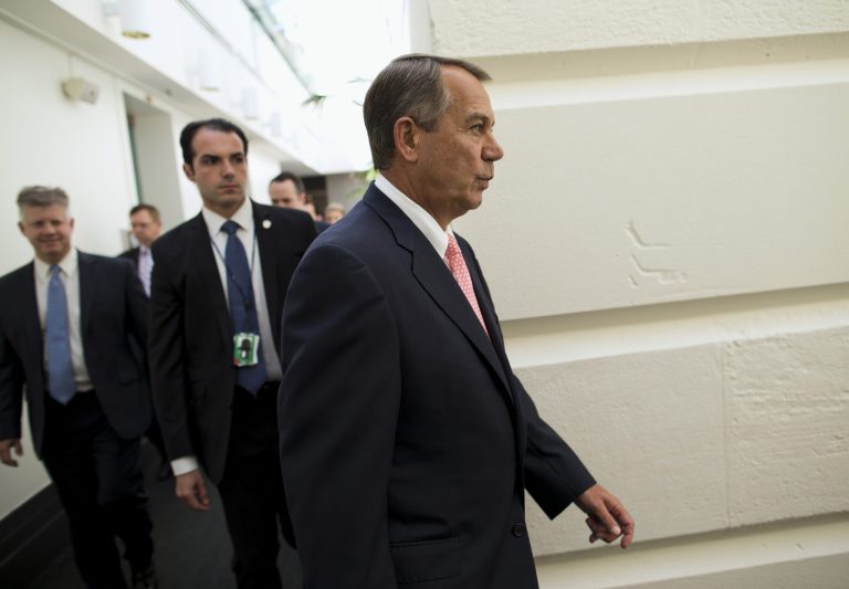 House Speaker John Boehner of Ohio walks to a House Republican Conference meeting to discuss the ongoing budget fight on Capitol Hill on Monday. (AP/Evan Vucci)
