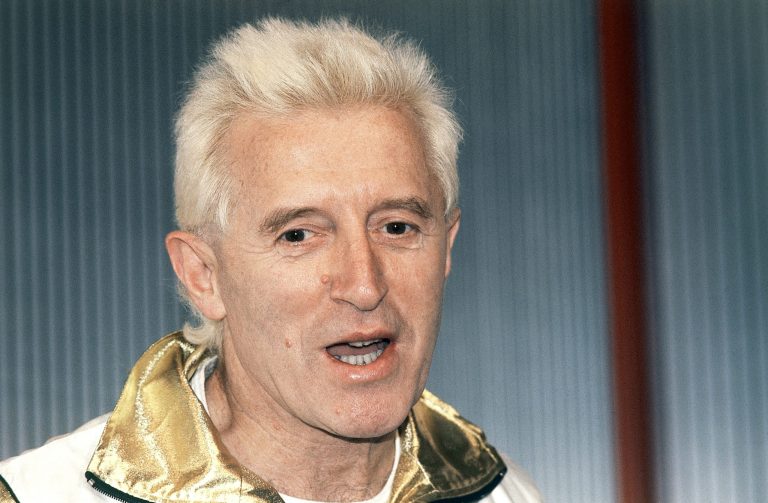FILE - In this Dec. 17, 1986, file photo, Disc jockey and presenter on Britain's Radio 1, Jimmy Savile is pictured at Madame Tussauds museum in London, England. Investigators said the late BBC entertainer Jimmy Savile sexually assaulted victims aged from five to 75 in hospitals across Britain over more than four decades.  A series of reports released Thursday June 25, 2014 found that Savile, who had unsupervised access to multiple hospitals as a celebrity and a fundraiser, abused both patients and hospital workers. (AP Photo/John Redman, File)