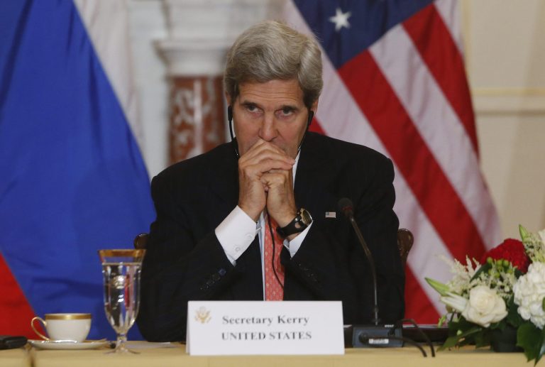   In this photo taken Aug. 9, 2013, Secretary of State John Kerry listens to translation as he meets with Russian Foreign and Defense ministers at the State Department in Washington, a sit-down tainted by the case of American National Security Agency leaker Edward Snowden, currently in Russia. This week on Kerry's first visit to South America as the Obama administration's chief diplomat, the disclosures by Snowden could chill talks on trade and energy, and even discussions about the Oct. 23 state dinner that President Barack Obama is hosting for Brazil's president, Dilma Rousseff. (AP Photo/Charles Dharapak)  