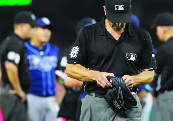 Alex Brandon/AP
Rays reliever Joel Peralta was ejected for having a "foreign substance" on his glove.