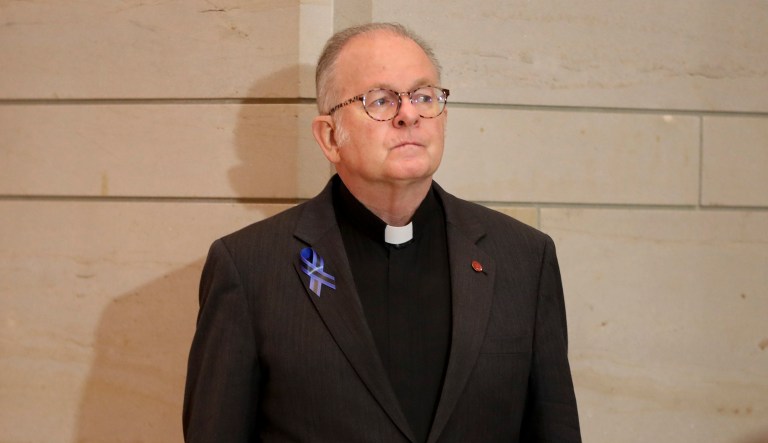 Rev. Patrick Conroy, chaplain of the House of Representatives, waits to speak at memorial service for U.S. Capitol Police officers who lost their lives in the line on duty, on Capitol Hill in Washington, Tuesday, May 8, 2018. House Speaker Paul Ryan has met with the House chaplain he ousted last month, then reinstated after the chaplain said a Ryan aide told him it might be time to put a non-Catholic in the job. Ryan told reporters he and Rev. Conroy talked about how to improve pastoral services over coffee today.