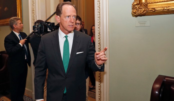 "We're going to take the U.S. business tax code from one of the worst in the world, from the point of view of a potential investor, to one of the best in the world," Toomey said. (AP Photo/Alex Brandon)