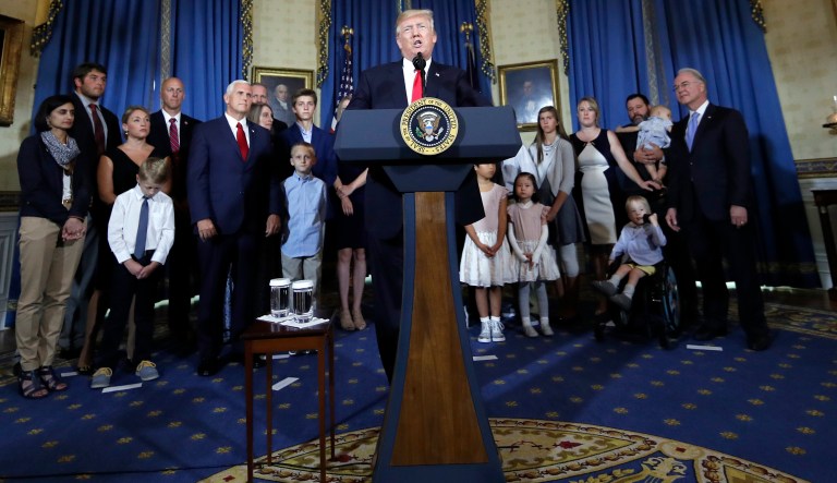 President Donald Trump, accompanied by Vice President Mike Pence and Health and Human Services Secretary Tom Price, speaks about healthcare, Monday, July 24, 2017, in the Blue Room of the White House in Washington. (AP Photo/Alex Brandon)