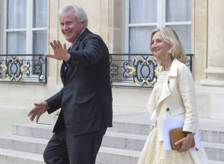 General Electric Co. CEO Jeffrey R. Immelt, left, and GE France chairwoman Clara Gaymard leave the Elysee Palace after a meeting with French President Francois Hollande at the Elysee Palace, Friday, June 20, 2014. The international race to take over France's engineering company Alstom SA entered its final stretch on Friday, with Siemens and Mitsubishi Heavy Industries responding to General Electric Co.'s sweetened bid by raising their own combined offer. (AP Photo/Michel Euler)