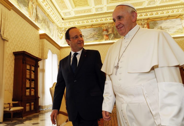 French President Francois Hollande, left, walks with Pope Francis on the occasion of their private audience at the Vatican, Friday, Jan. 24, 2014. Hollande met Friday with Pope Francis amid tensions in his private life over a gossip magazine's report about an alleged affair with an actress. (AP Photo/Alessandro Bianchi, Pool)