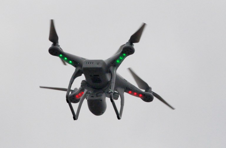 FILE - This March 12, 2014, file photo shows a drone flown by Brian Wilson, landing after flying over the scene of an explosion that leveled two apartment buildings in the East Harlem neighborhood of New York. Even though it's illegal to fly the devices just about anywhere in New York City without permission, the incidents and breathtaking videos of Manhattan's steel-and-glass canyons and sweeping skyline photos suggest that the restrictions are being widely flouted. (AP Photo/Mark Lennihan, File)