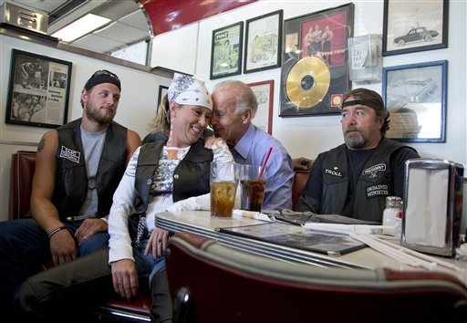 Photo: Biker woman sits on Biden’s lap
